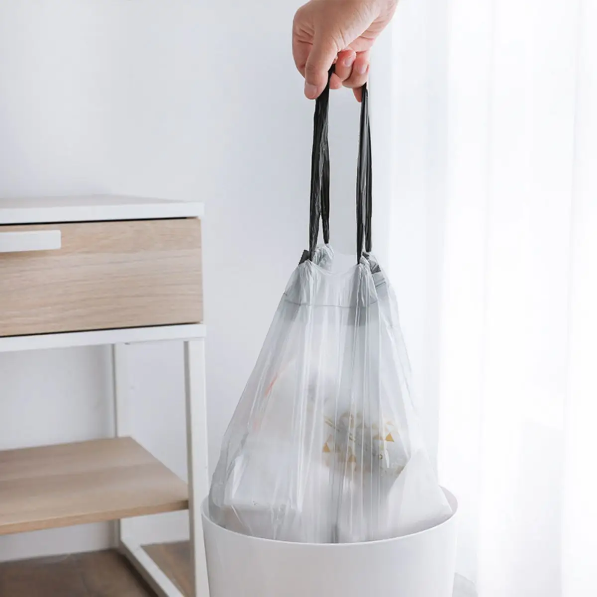 Disposable drawstring trash bags